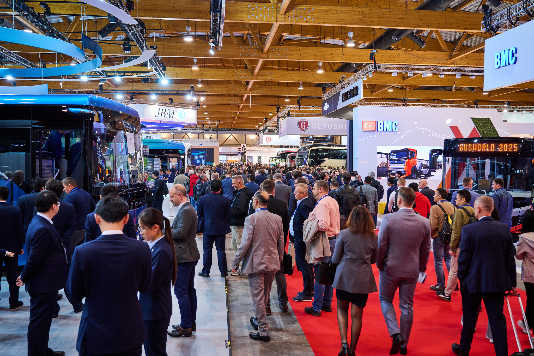 Visitors exploring buses, coaches and meeting industry professionals at Busworld Europe 2025, the international bus and coach exhibition in Brussels, Belgium